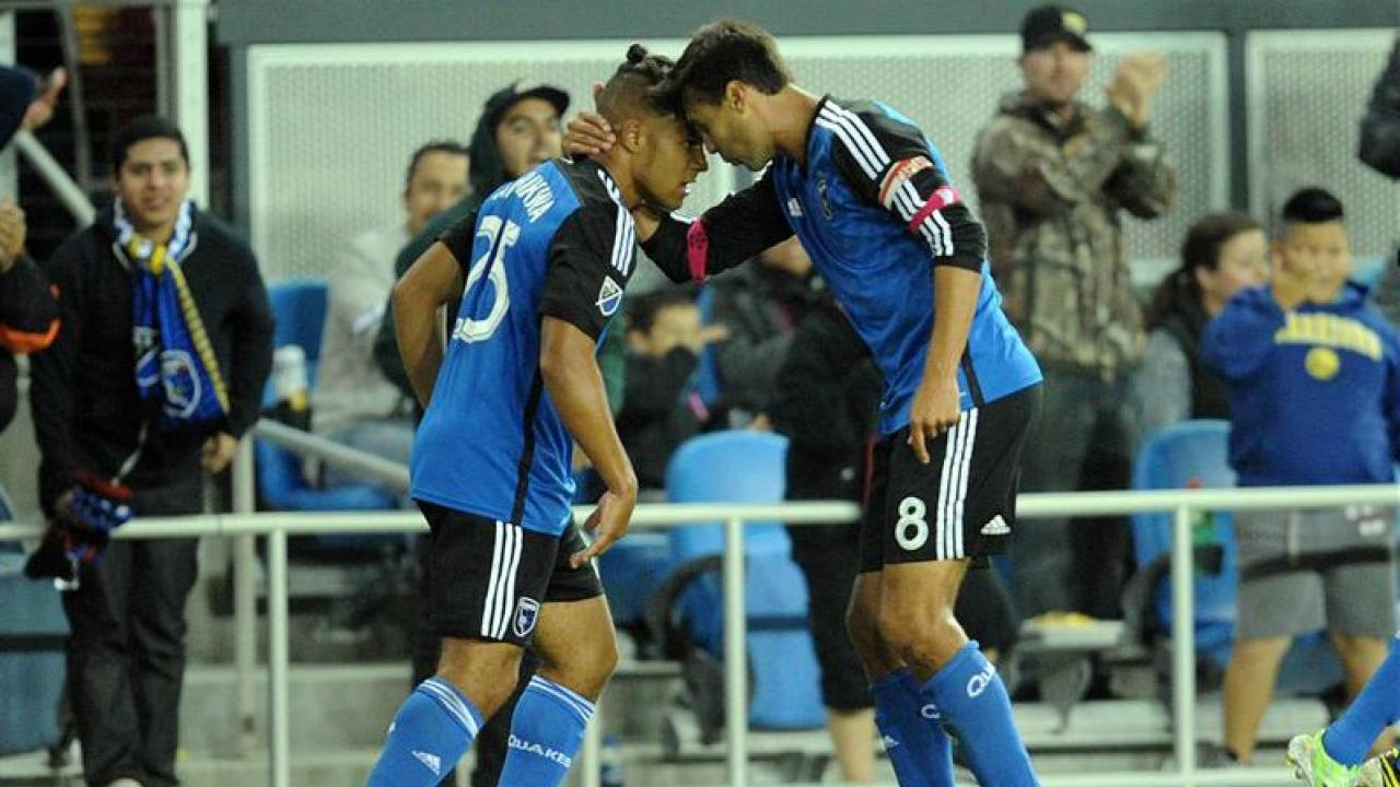 Quincy Amarikwa celebrates his goal with fellow forward, Chris Wondolowski.