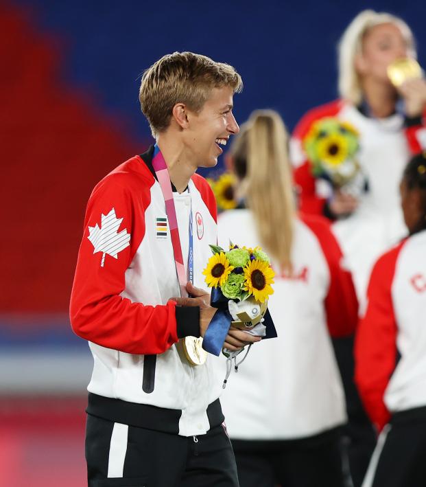 Quinn and Megan Rapinoe talk after the medal ceremony for women's soccer at the Tokyo Olympics