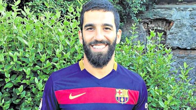 Arda Turan in a Barcelona shirt. 