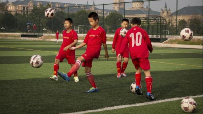 Chinese children practicing soccer