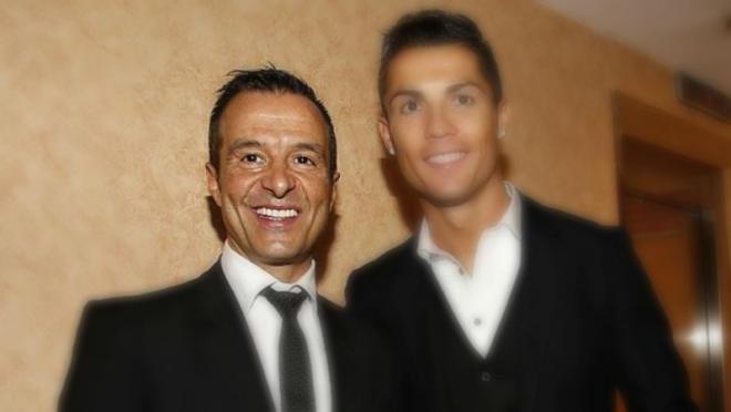 Jorge Mendes and Cristiano Ronaldo, smiling for a photo at some function. 