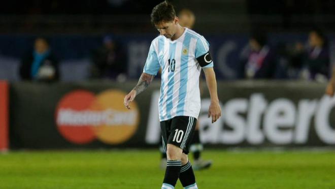 Lionel Messi looking upset in his Argentina kit.