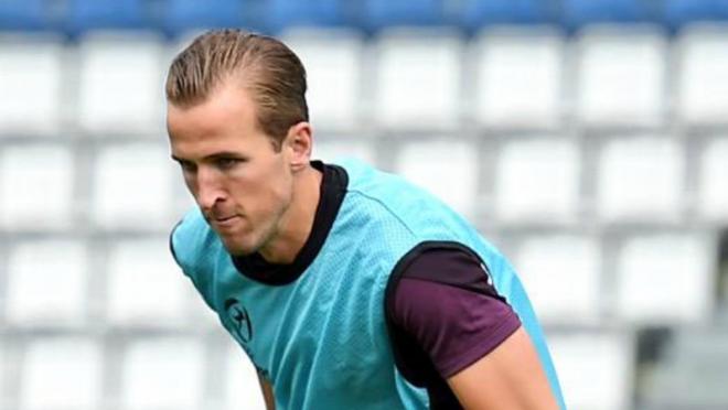 Harry Kane is shown running through a drill during England practice. 