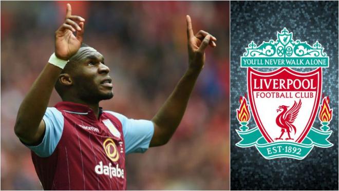 Benteke pointing to the sky next to a Liverpool logo.