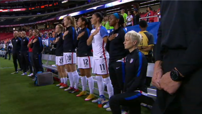 Megan Rapinoe kneels during the anthem.