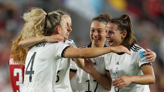 Germany players celebrate their third goal against Denmark