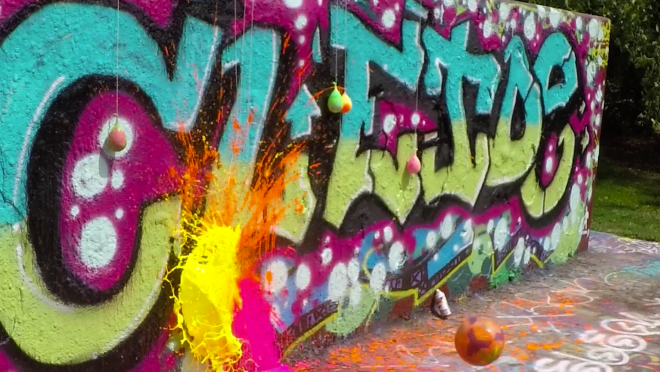 Popping Paint Balloons Hanging On A Graffiti Wall