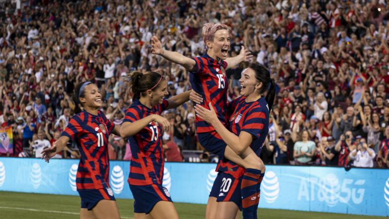 Kornieck and Rapinoe celebrate after goal.