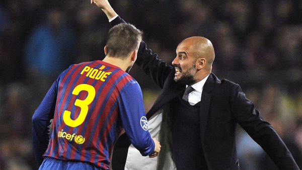 Gerard Pique and Pep Guardiola