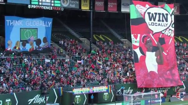 A cheering crowd with tifos, like the one that will await Kansas City FC and Seattle Reign FC in the 2015 NWSL Final at Providence Park