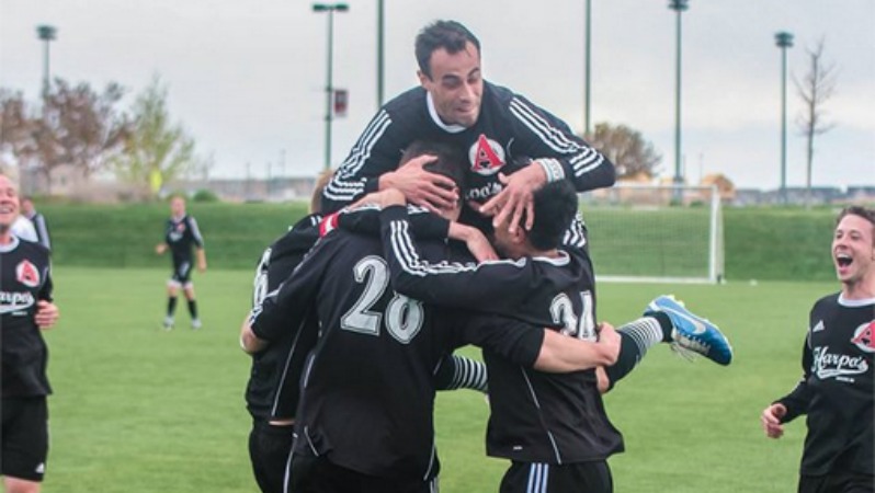 Harpo's FC celebrates after scoring a goal.